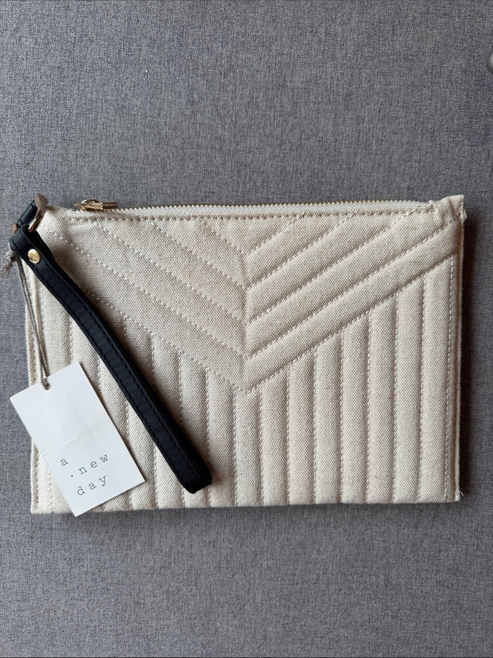 a new day Quilted Ivory Canvas Wristlet with Black Strap